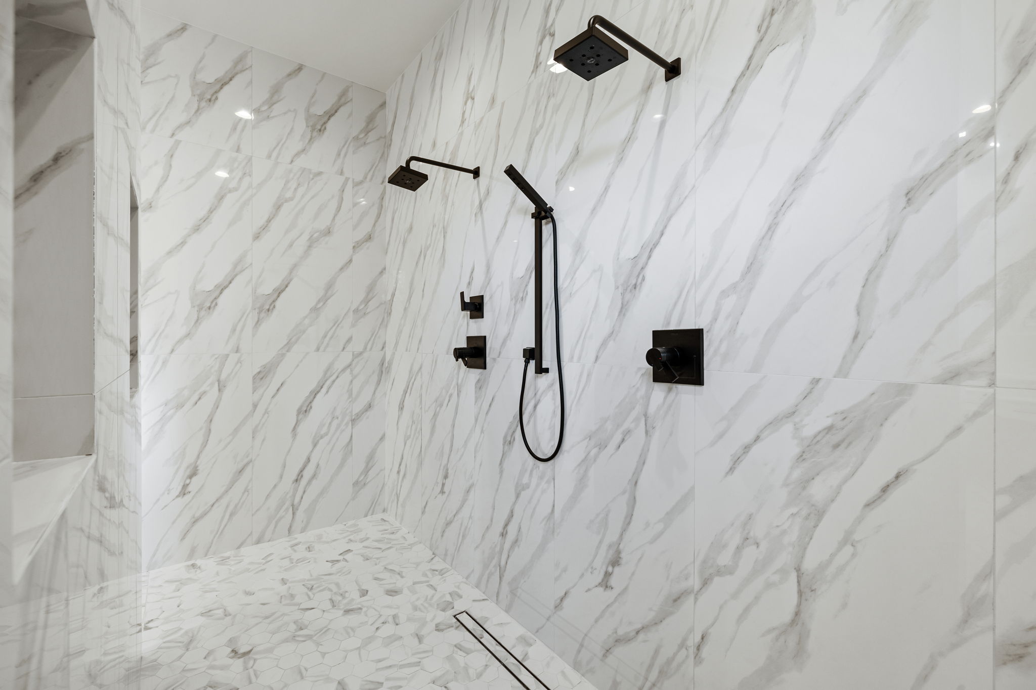Bookmatched stone shower detail at Golden Hour