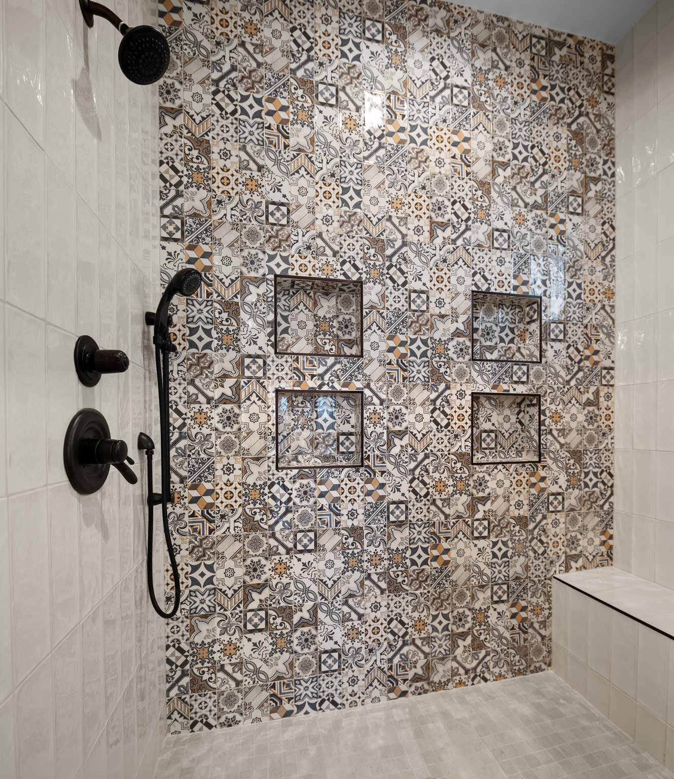 Hand-set patterned tile in a Ridge House shower