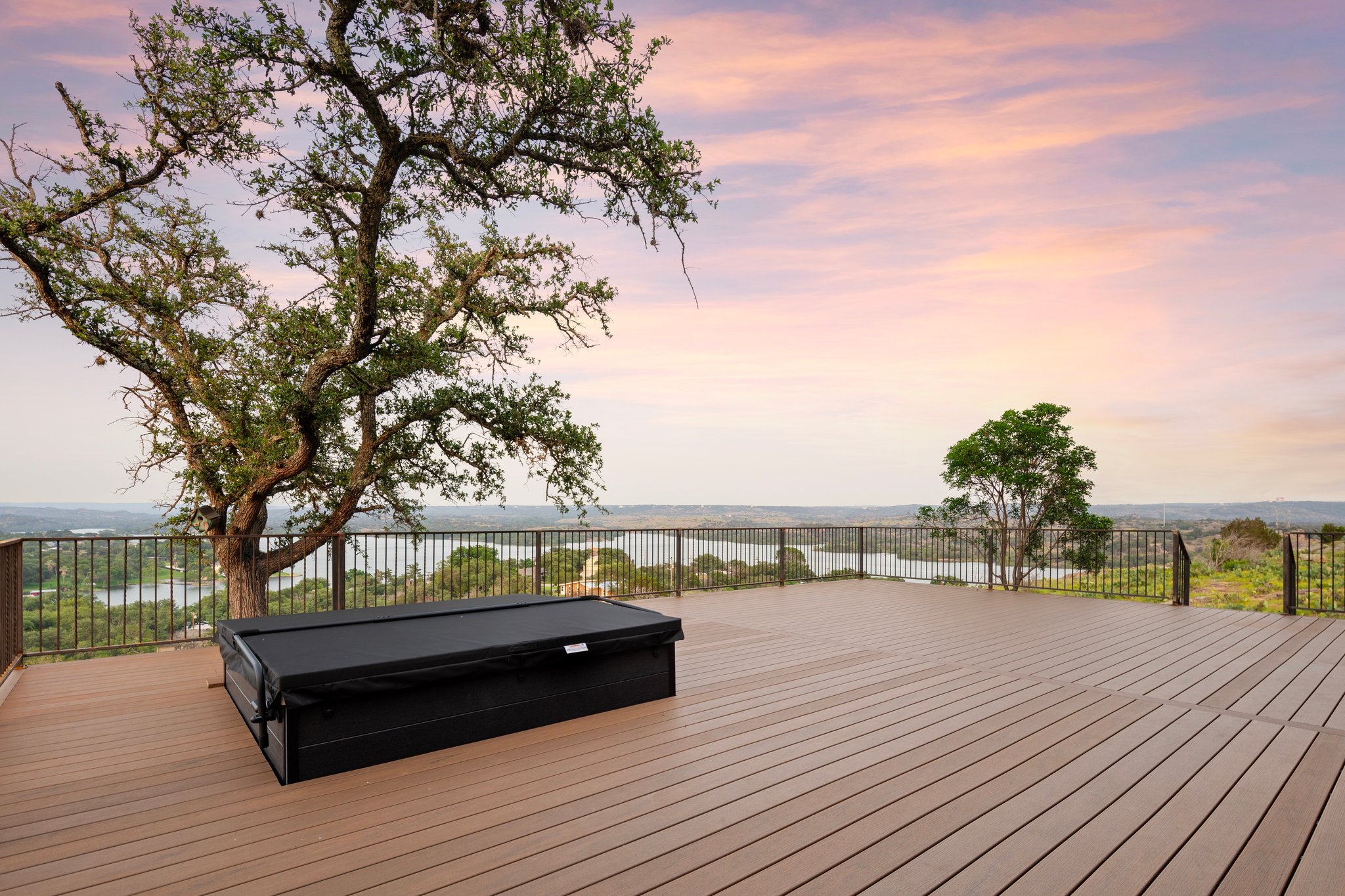 Ridge House terrace overlooking Buchanan Dam at sunset