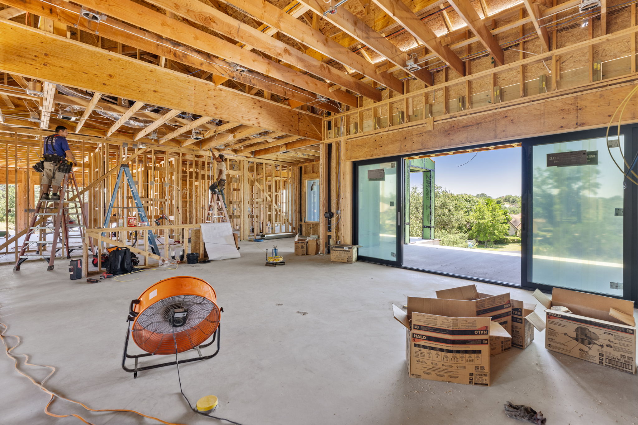 Oakline timber framing defining a broad living room opening