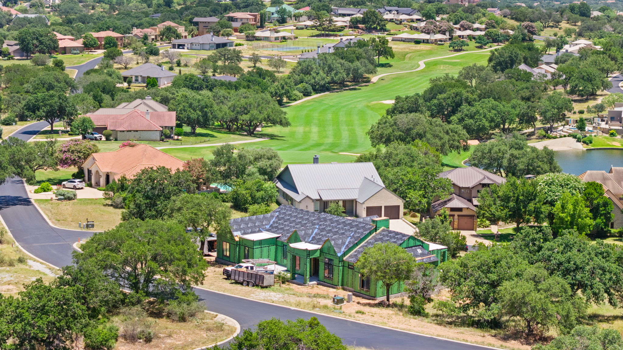 Aerial view of Oakline taking shape among mature oaks