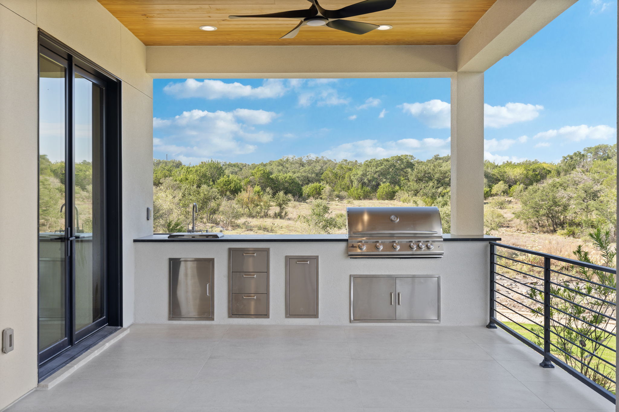 The Lookout's finished outdoor kitchen and covered terrace overlooking the Hill Country